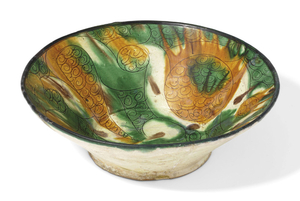A TANG-SPLASHED CONICAL POTTERY BOWL, EASTERN IRAN, 10TH CENTURY