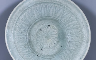 A Thai Celadon Bowl, incised with flower and leaf...
