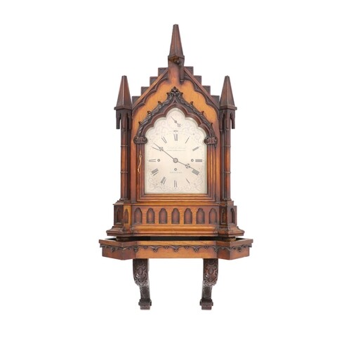 A Victorian golden oak Gothic design chiming bracket clock b...