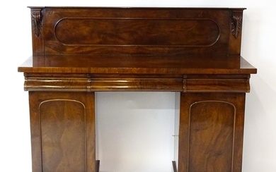 A Victorian mahogany double pedestal sideboard with a panell...