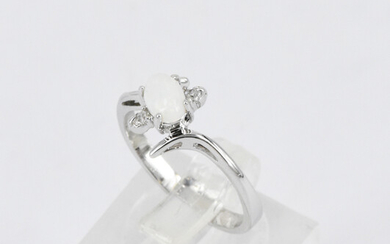 A WHITE SOLID OPAL RING