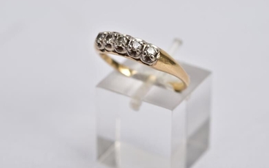 A YELLOW METAL DIAMOND RING, designed with a row...