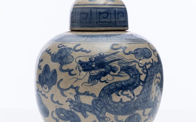 A blue and white ginger jar with dome form lid decorated with dragons, height 25cm