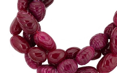 A carved ruby bead necklace