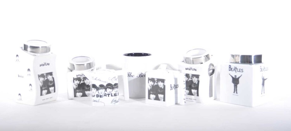 A collection of reproduction Beatles Ware in black and white, two teapots, storage jars etc.