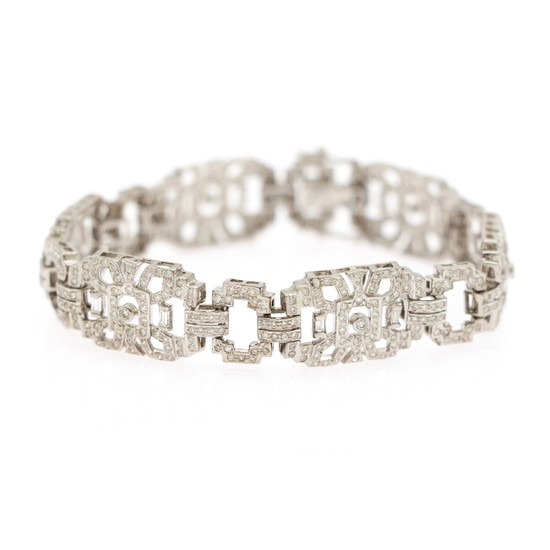 A diamond bracelet set with numerous baguette- and brilliant-cut diamonds, totalling app. 4.65 ct., mounted in 14k white gold. L. 19.5 cm.