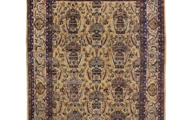 A fine Kashan silk souf rug, Persia. All over flowervase design on a golden field, executed in relief technic. Early 20th century. 205×130 cm.