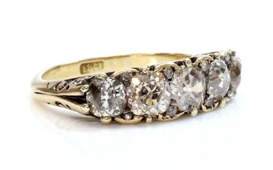 A five stone diamond carved head ring
