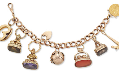 A gold charm bracelet, of hollow curb-link design with gold...