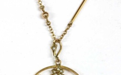 A gold garnet and split pearl pendant