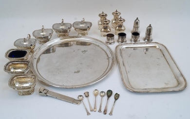A group of silver plate, comprising: a circular tray, 35cm dia.; four mustard pots having covers with urn finials; four peppers, with three missing blue glass liners; two salt-cellars; three open salts with gadrooned rims and stepped bases, two...