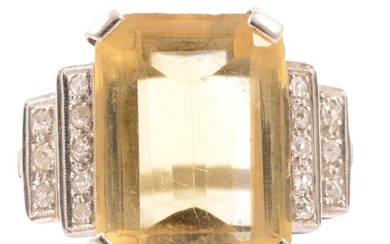 A lady's large citrine and diamond dress ring.