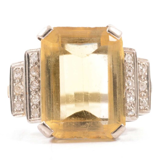 A lady's large citrine and diamond dress ring.