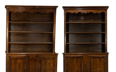 A large assembled pair of Louis XV style mahogany breakfront bookcase cabinets