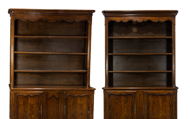 A large pair of Louis XV style mahogany breakfront bookcase cabinets