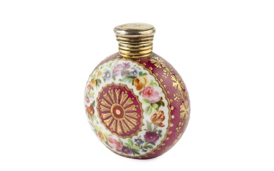 A late 19th century French porcelain scent bottle, of rounded...