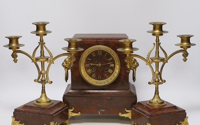 A late 19th century French rouge marble and ormolu clock gar...