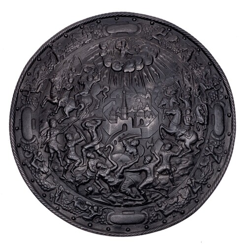A late 19th century cast iron wall shield,: of circular outl...