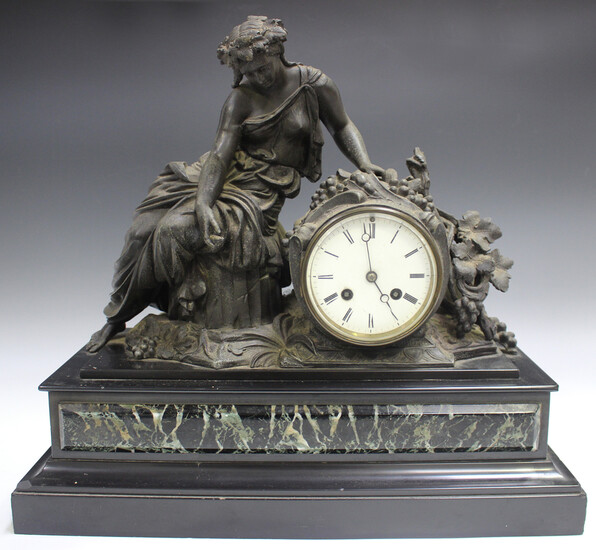 A late 19th century cast spelter, slate and marble mantel clock with eight day movement striking on