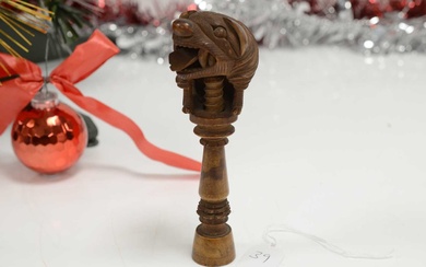 A late 19th or early 20th century Black Forest wooden nut cracker