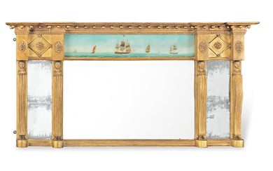 A late George III 'Egyptian revival' giltwood and reverse glass painted landscape overmantel mirror
