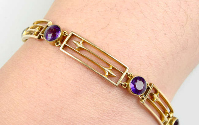 A late Victorian 15ct gold amethyst and openwork panel bracelet.
