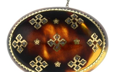 A late Victorian gold pique tortoise shell brooch.