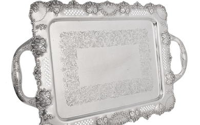 A late Victorian silver shaped rectangular twin handled tray by John Hines