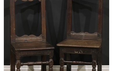 A near pair of 17th century oak backstools, boarded seats, t...