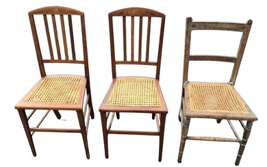 A pair of Edwardian mahogany chairs with arched backs inlaid...