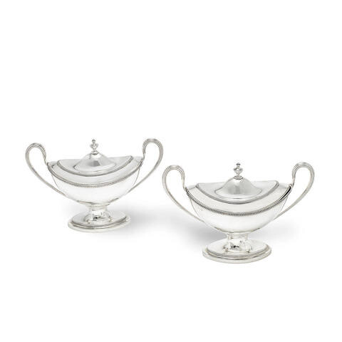 A pair of George III Irish silver covered two-handled sauce tureens