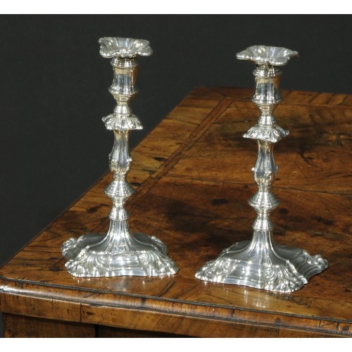 A pair of William IV silver tapersticks, detachable nozzles,...