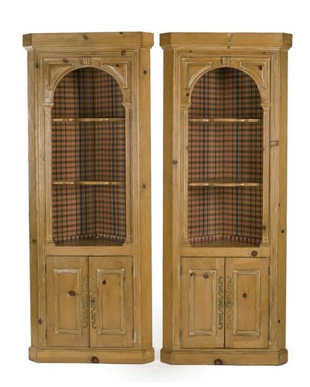 A pair of corner cabinets