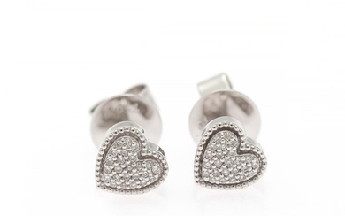 A pair of diamond ear studs in the shape of a heart each set with numerous diamonds weighing a total of app. 0.11 ct., mounted in 18k white gold. (2)