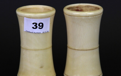A pair of early 20th Century turned ivory dice shakers, H. 10cm.