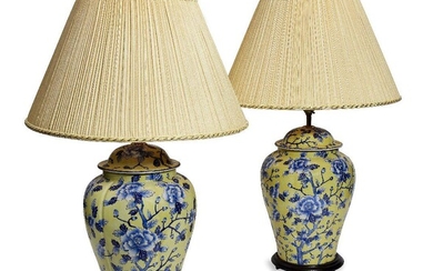 A pair of modern Chinoiserie yellow ground table lamps, modelled as ginger jars and covers, decorated overall with chrysanthemum, on hardwood bases, 40cm high excluding fitment (2) It is the buyer's responsibility to ensure that electrical items...
