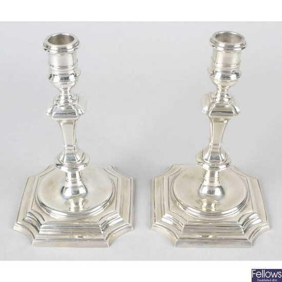A pair of modern silver reproduction candlesticks.