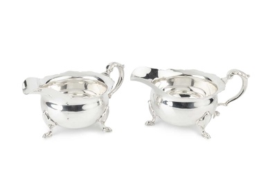 A pair silver sauce boats, of rounded circular form with...