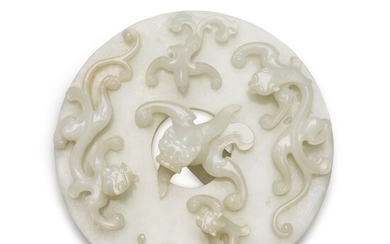 A rare large white jade 'dragon and phoenix' disc, bi Qing dynasty, 18th century | 清十八世紀 白玉仿古螭龍鳳紋璧