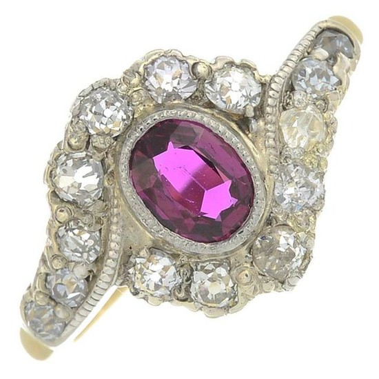 A ruby and diamond cluster ring.Ruby weight