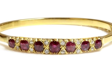 A ruby and diamond hinged bangle