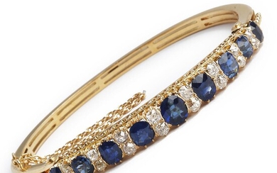 NOT SOLD. A sapphire and diamond bangle set with numerous oval-cut sapphires weighing a total of app. 7.00 ct. and old-cut diamonds weighing a total of app. 1.30 ct., mou – Bruun Rasmussen Auctioneers of Fine Art