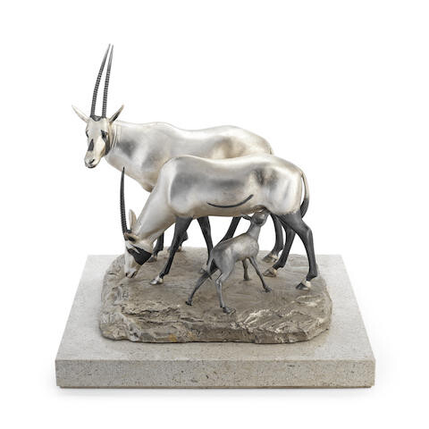 A silver model of an ibex family