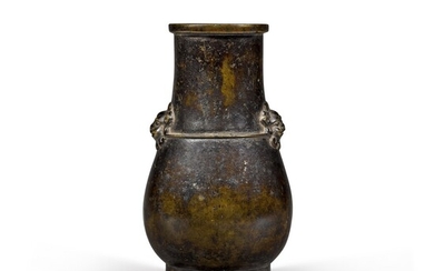 A small bronze hu-shaped vase with applied lion-mask handles Ming dynasty | 明 銅雙耳瓶