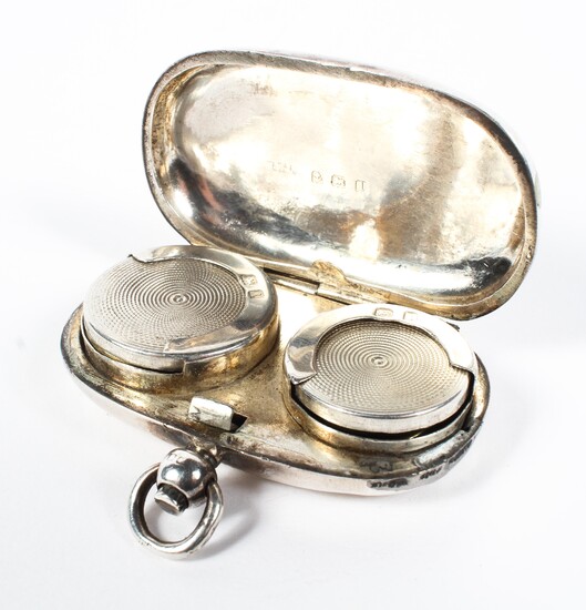 A sterling silver sovereign and half sovereign case. by Henry Williamson, Birmingham 1910. 29g.