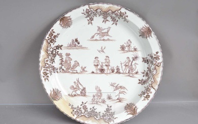 A very large French faience charger in the Moustiers 18th Century style