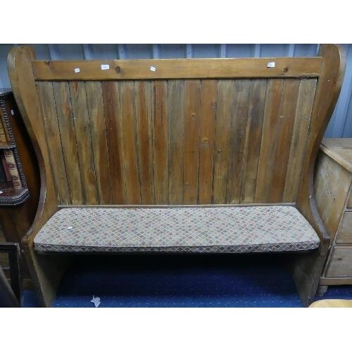 A vintage pine high back Settle, with scrolling end supports...