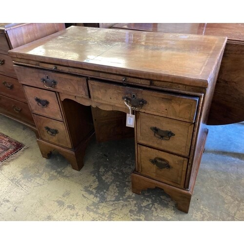 A walnut kneehole dressing table/desk, incorporating antique...