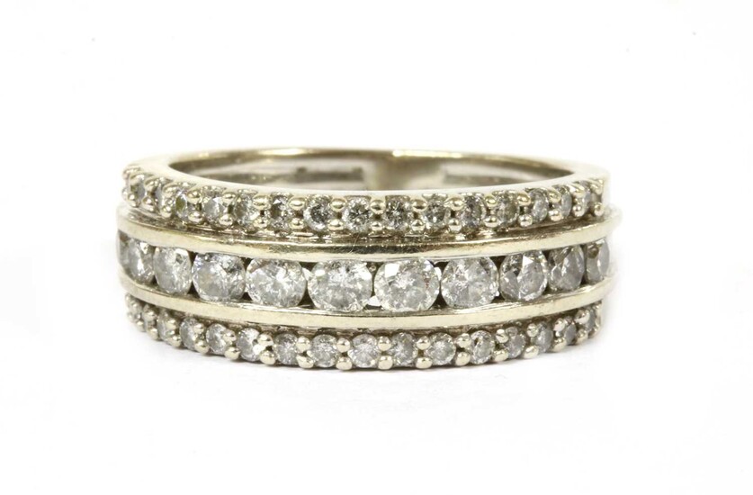 A white gold three row diamond ring