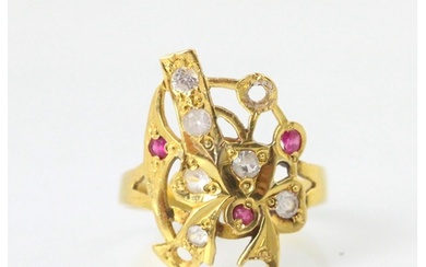 A yellow metal and untested ruby and white stone dress ring,...